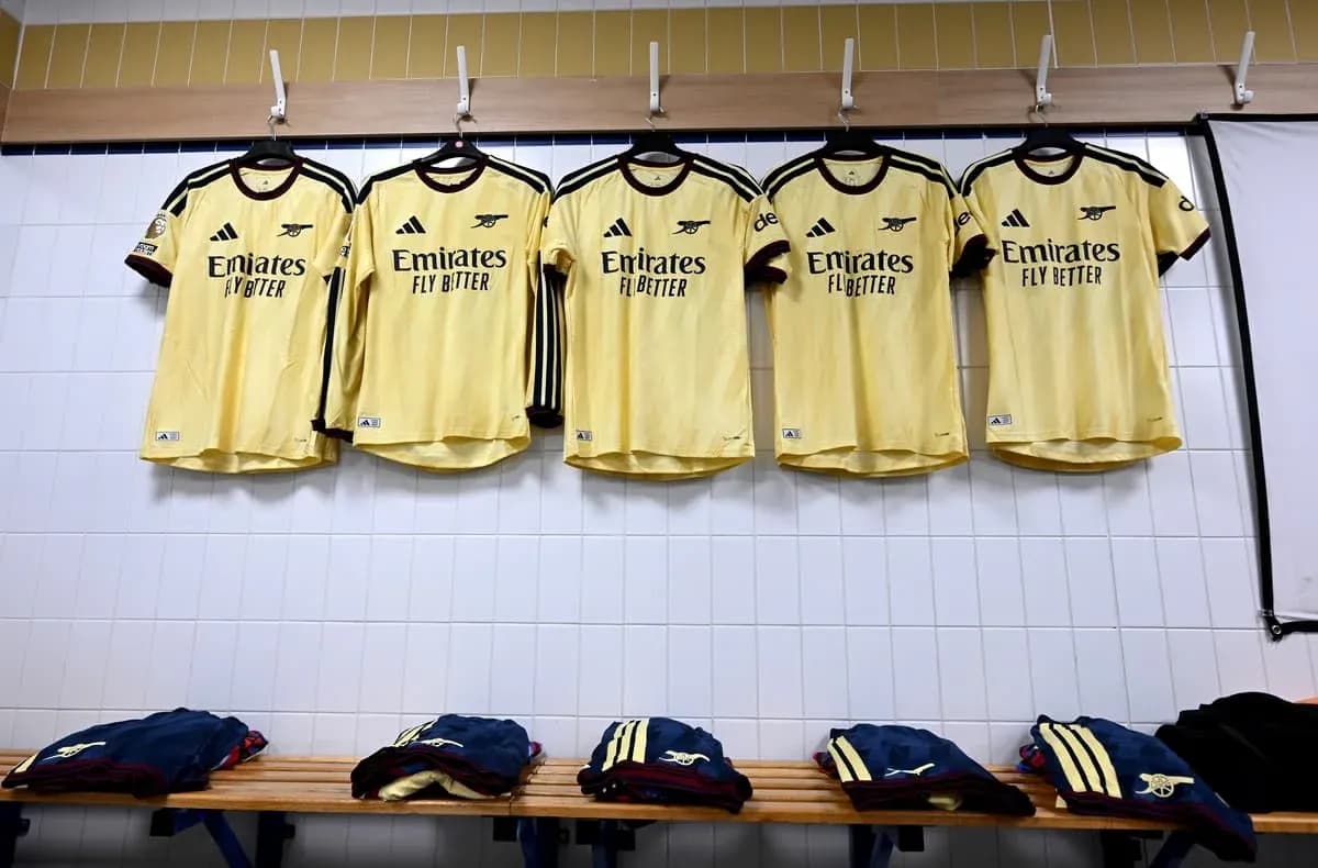 Yellow Arsenal jerseys hanging in locker room