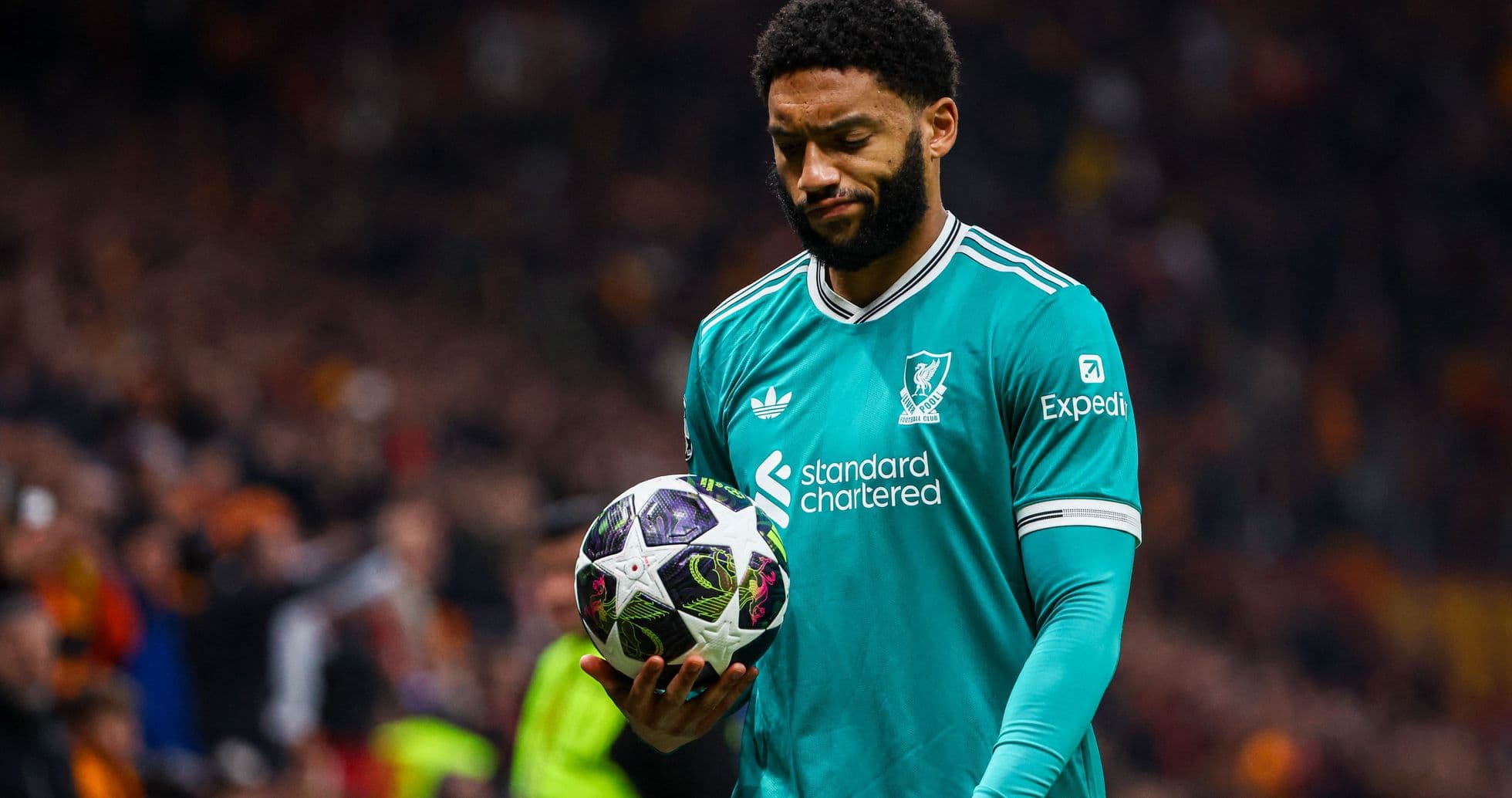 Goalkeeper holding ball during match at stadium