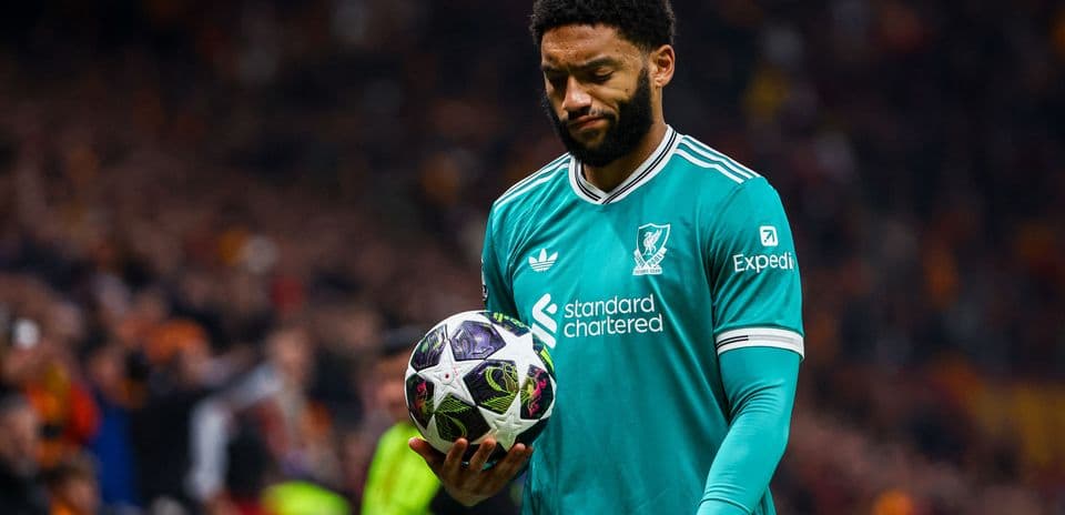 Goalkeeper holding ball during match at stadium