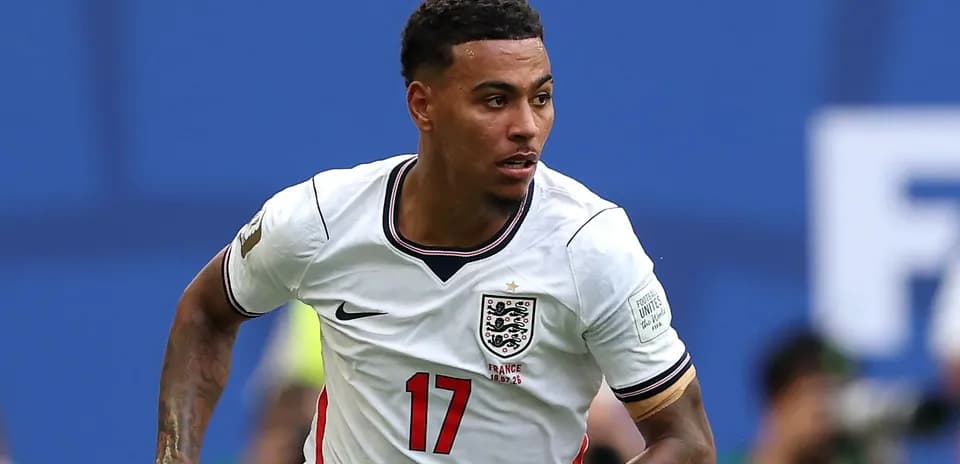 Player sprinting in England kit during match