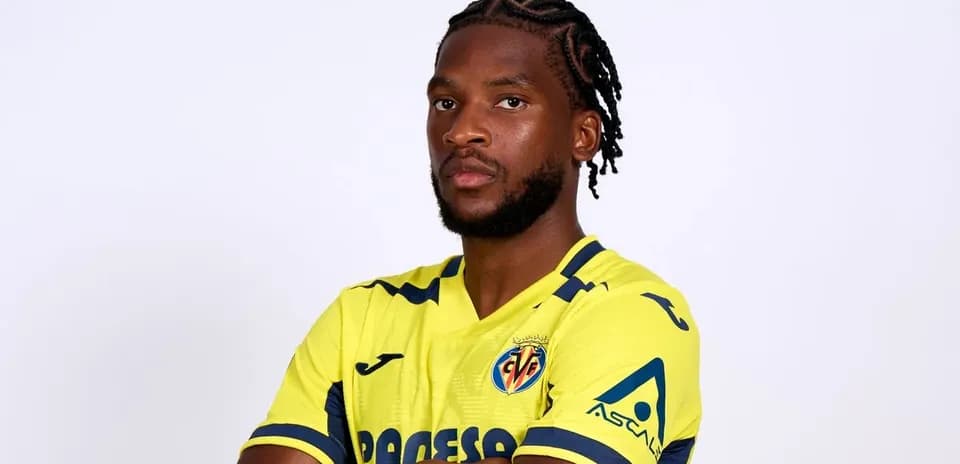 Player posing in Villarreal home jersey