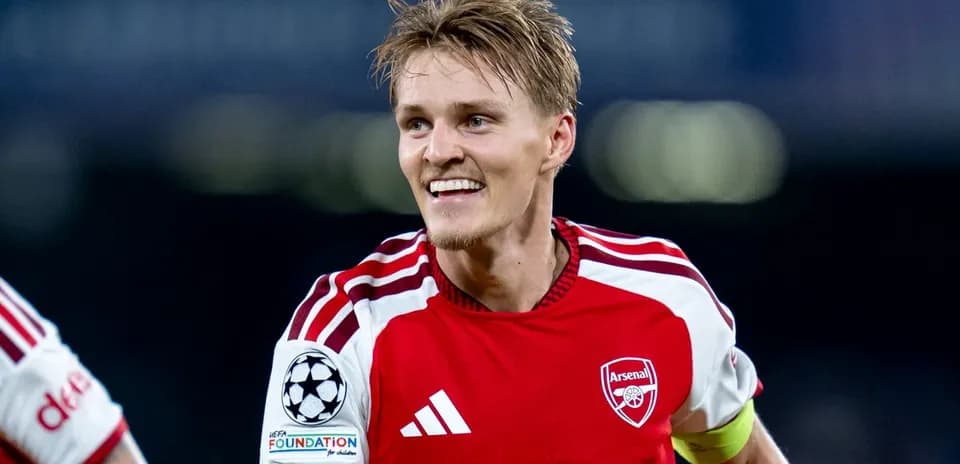 Arsenal player celebrating on the pitch