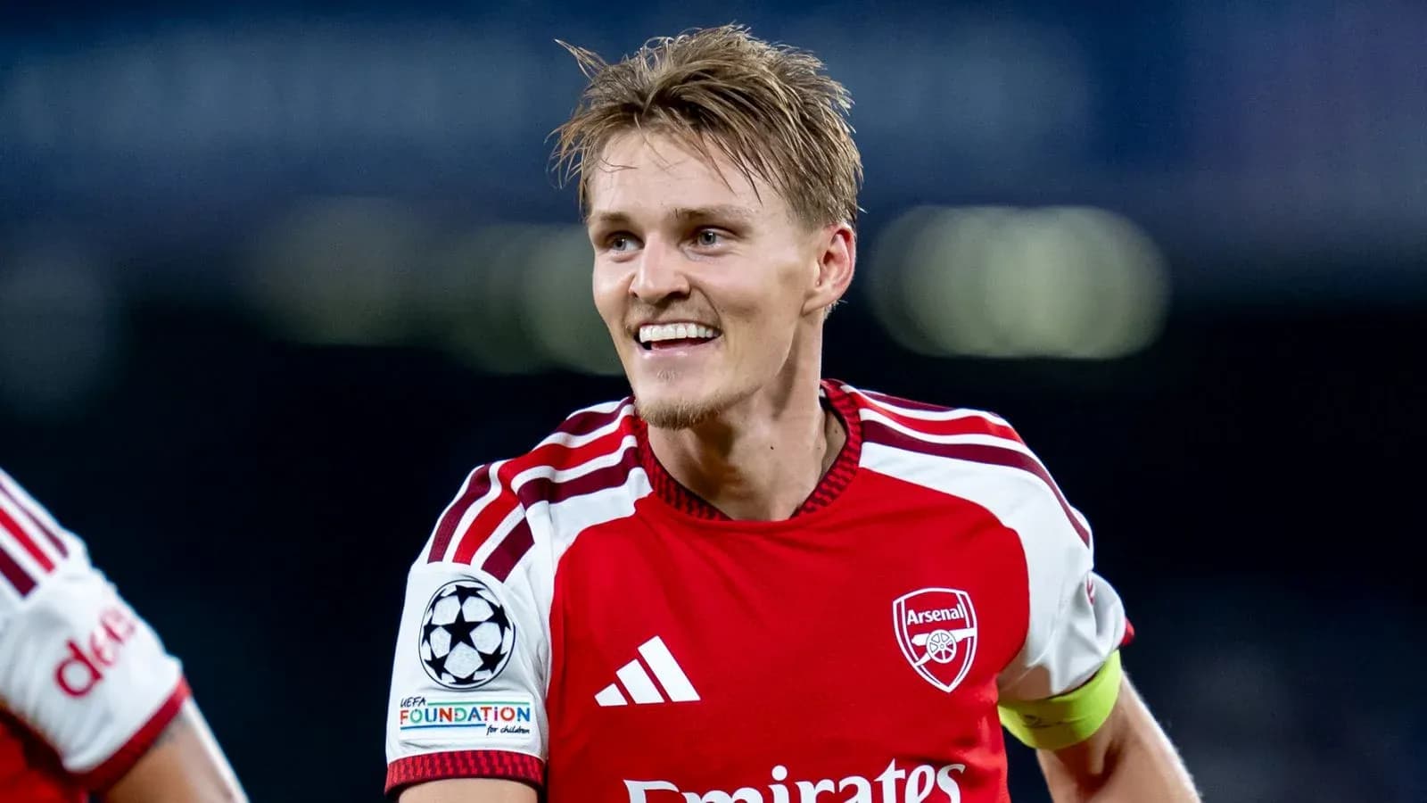 Arsenal player celebrating on the pitch
