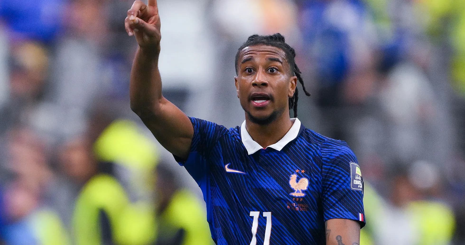 Player gesturing during a football match for France