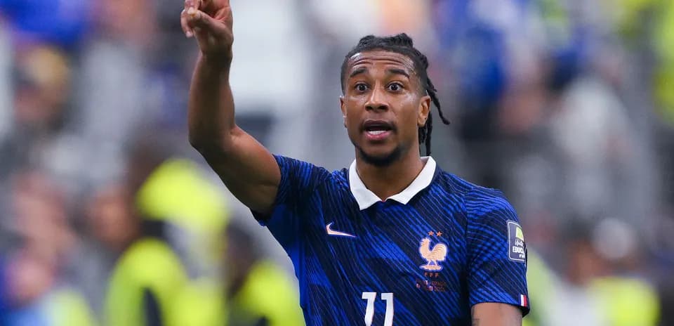 Player gesturing during a football match for France