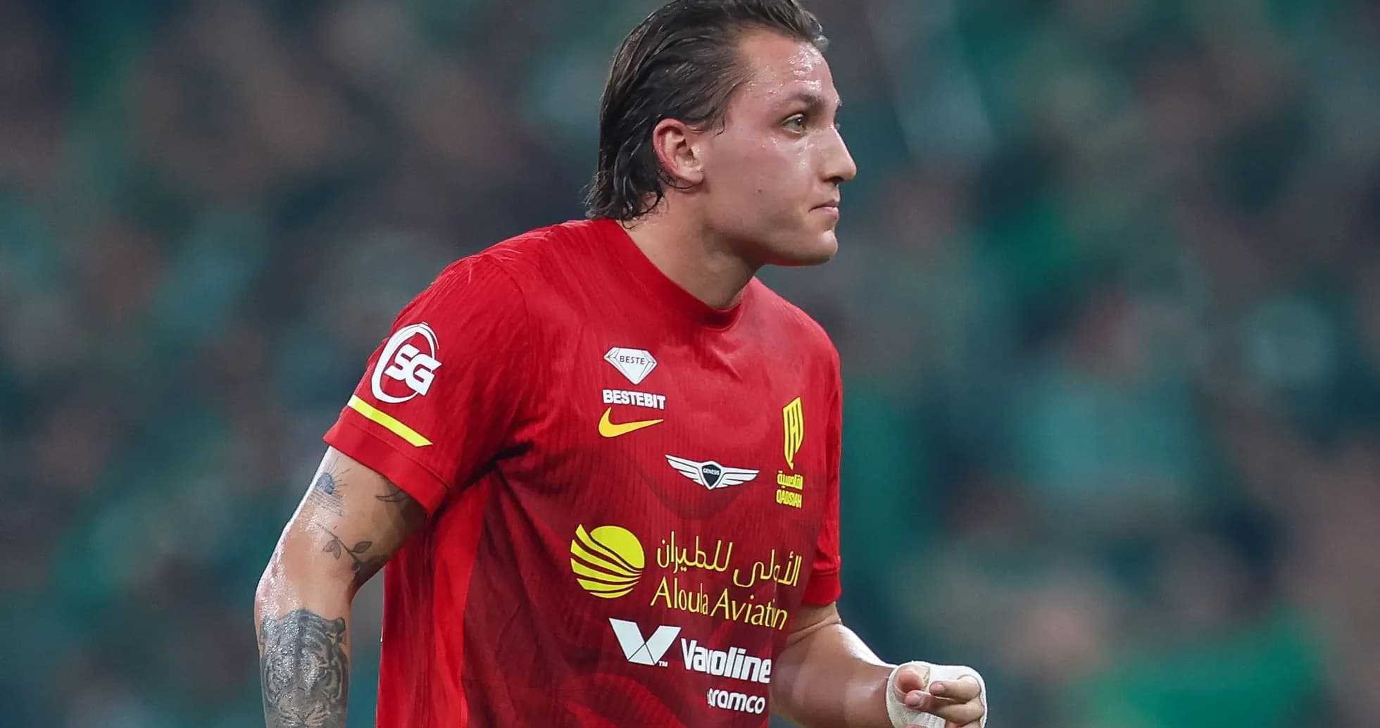 Player in red jersey during a match