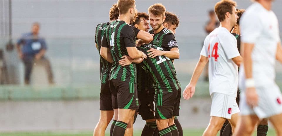 Austin II players celebrating a goal during match