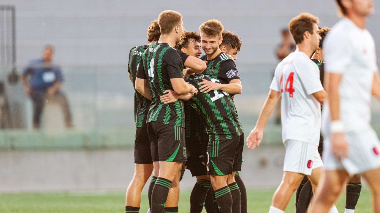 Austin II players celebrating a goal during match