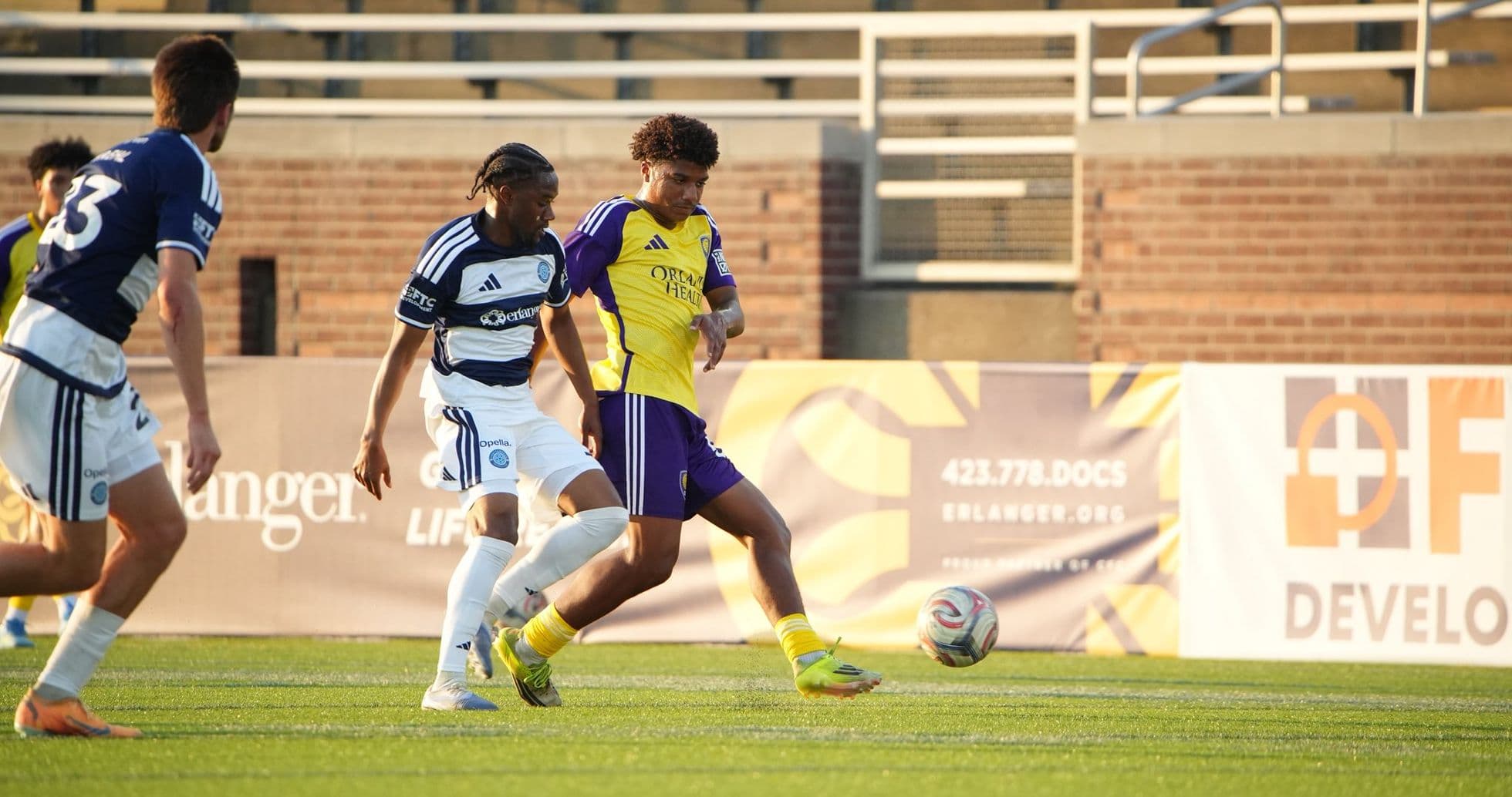Orlando City II player dribbling against Chattanooga