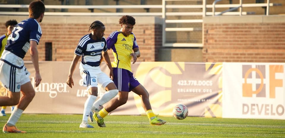 Orlando City II player dribbling against Chattanooga