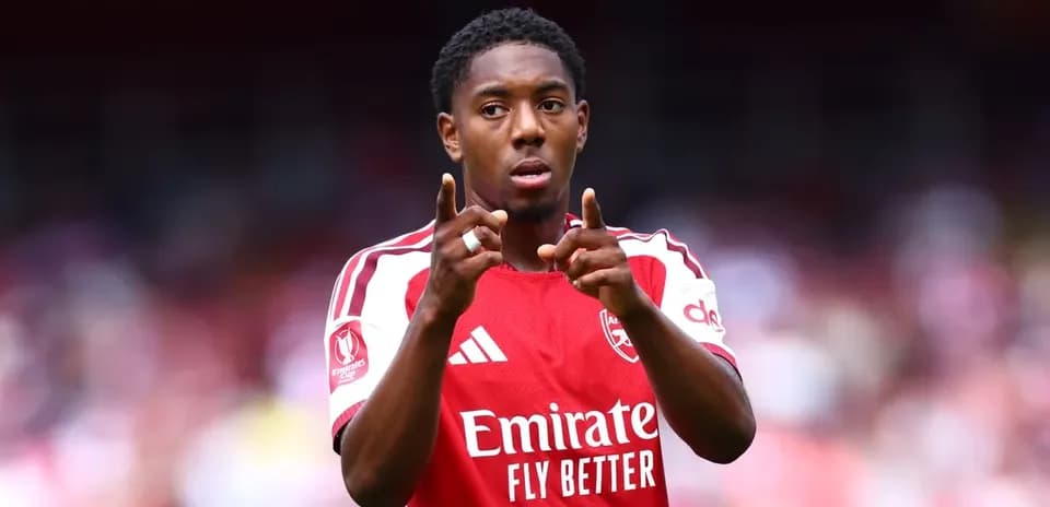 Player gesturing during Arsenal match on field