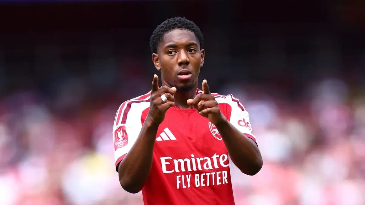 Player gesturing during Arsenal match on field