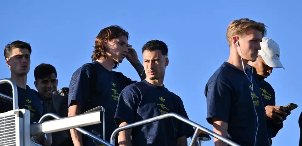 Players descending stairs during team arrival