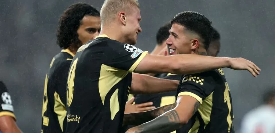 Players celebrating a goal during a match