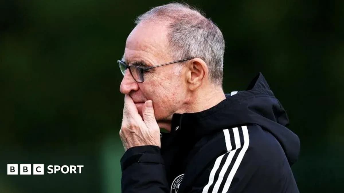 Coach observing training session with thoughtful expression