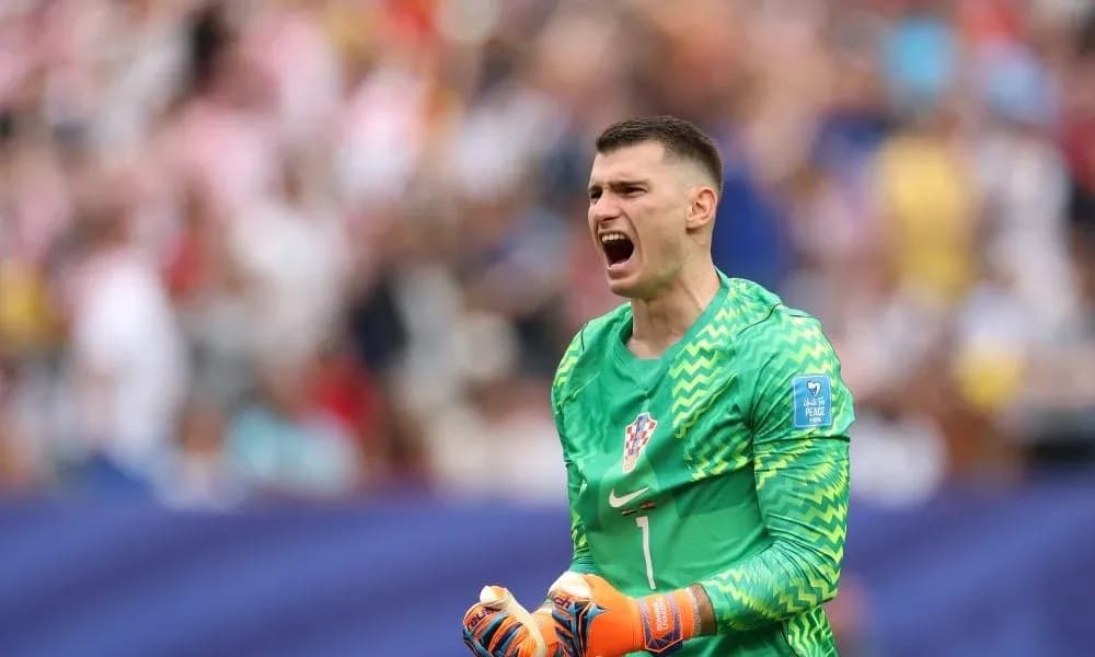 Goalkeeper celebrating during match with fans in background