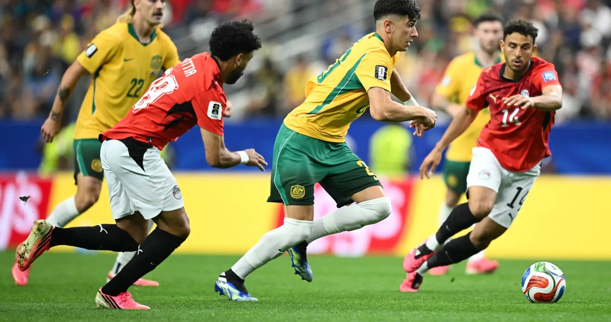 Australia and Egypt players competing for the ball