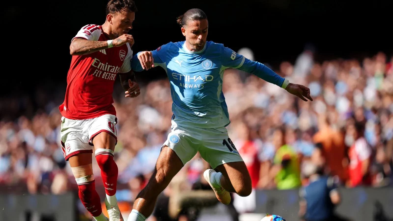 Two players battling for the ball during match