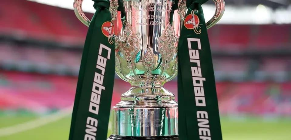 Carabao Cup trophy displayed on green pedestal