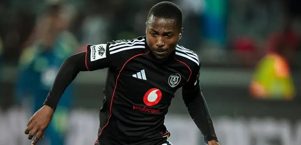 Player in black jersey sprinting on the field