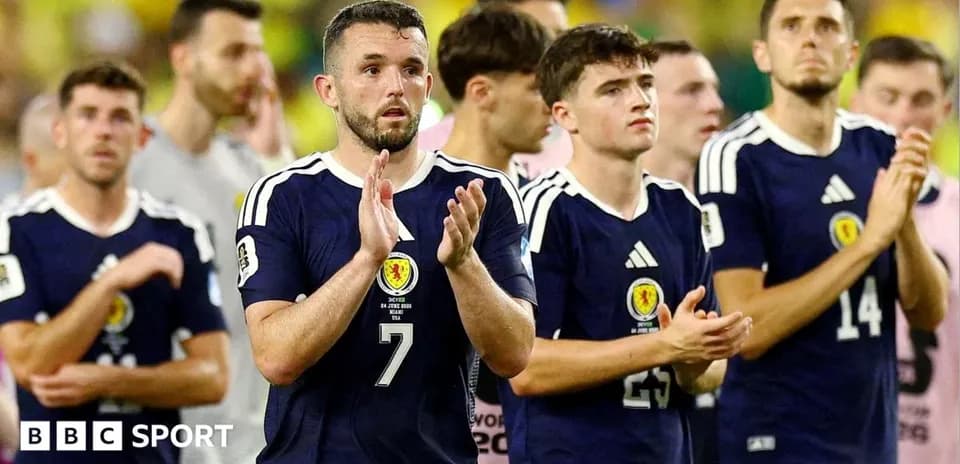 Scotland players applauding after match conclusion