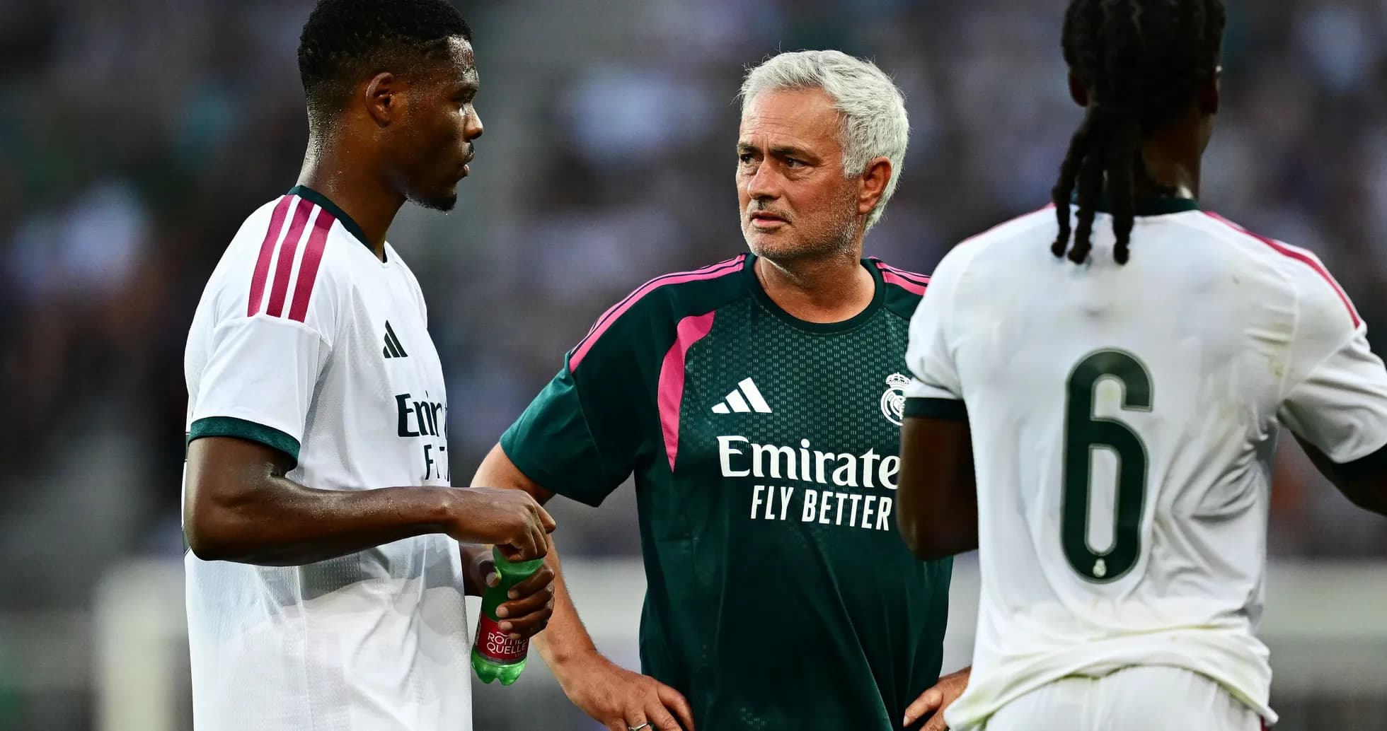 Player and coach discussing strategy during training session