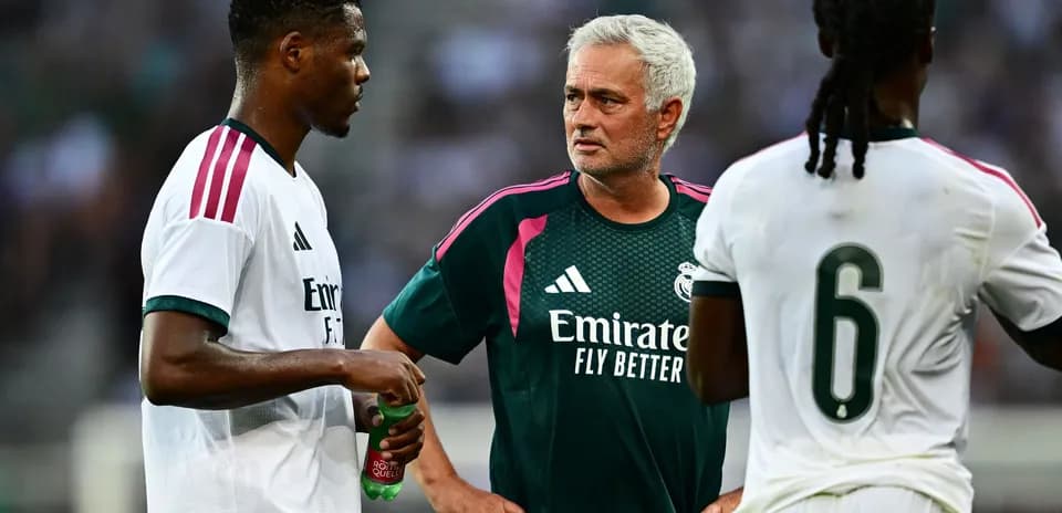 Player and coach discussing strategy during training session