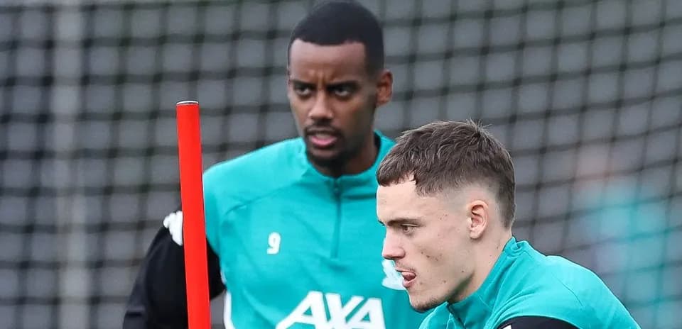 Two players training with a pole during session