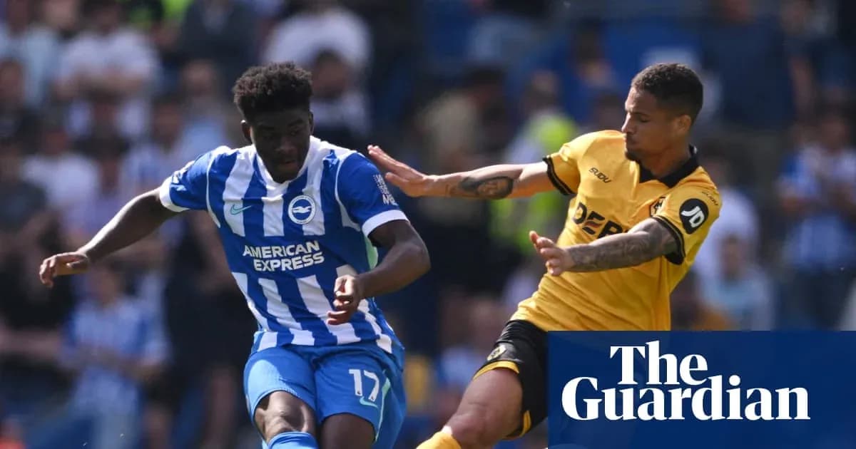 Brighton player dribbling past opposing defender during match
