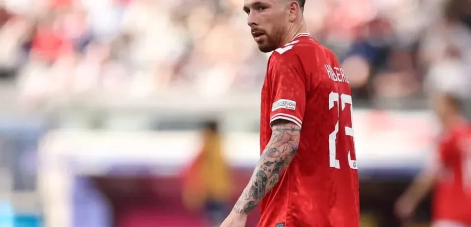 Player in red jersey on the field during match