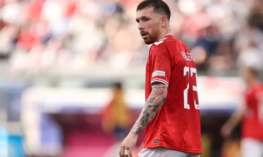 Player in red jersey on the field during match