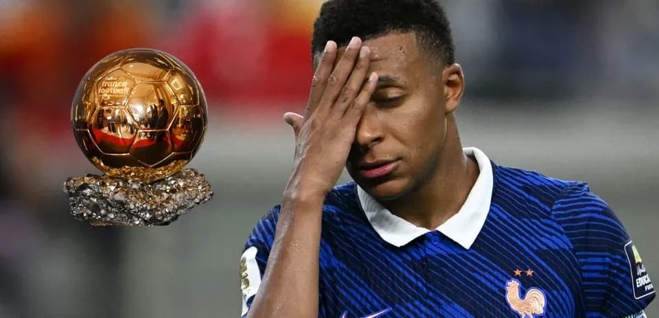 Player reacting near a Ballon d'Or trophy