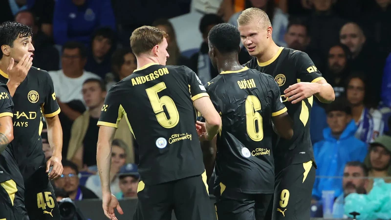 Players celebrating after a goal during match