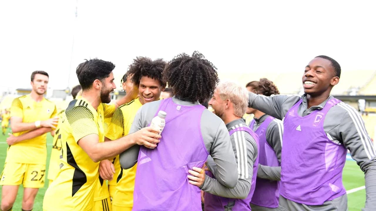 Columbus Crew II players celebrating together