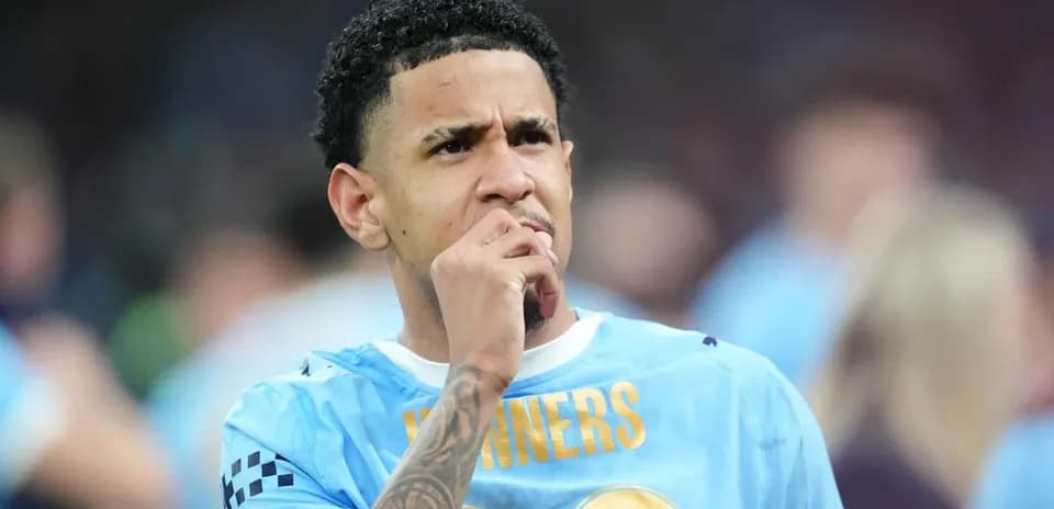 Player in blue jersey thinking during match