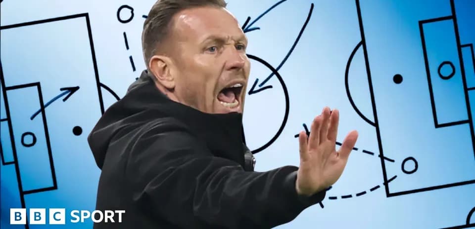 Coach instructing players with tactical board behind