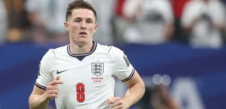 Player in England kit running on the pitch
