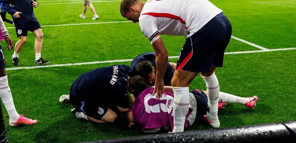 Players attending to injured teammate on the field