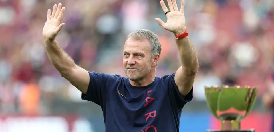 Coach waving during trophy presentation ceremony