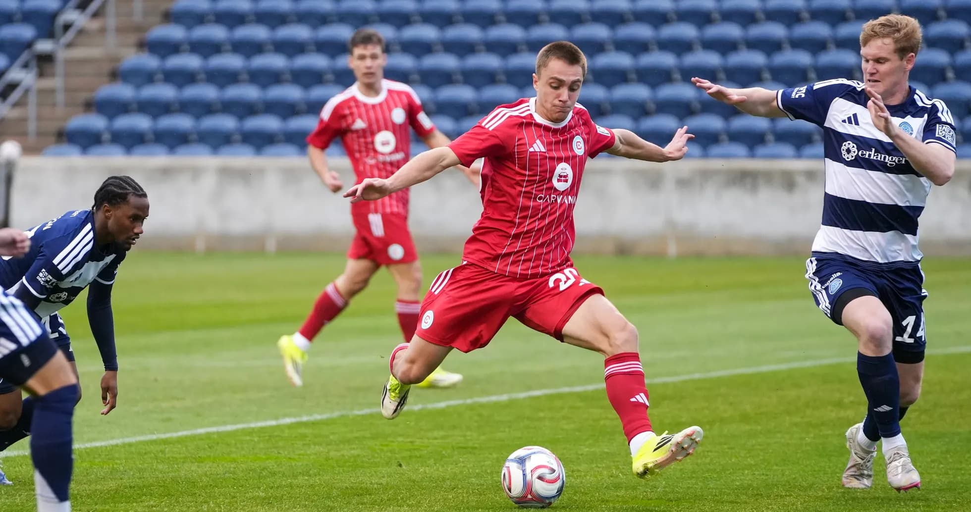 Chattanooga player dribbling past Chicago Fire II defenders