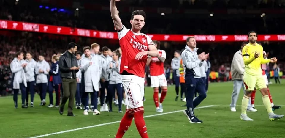 Player waving to fans after match at Emirates Stadium
