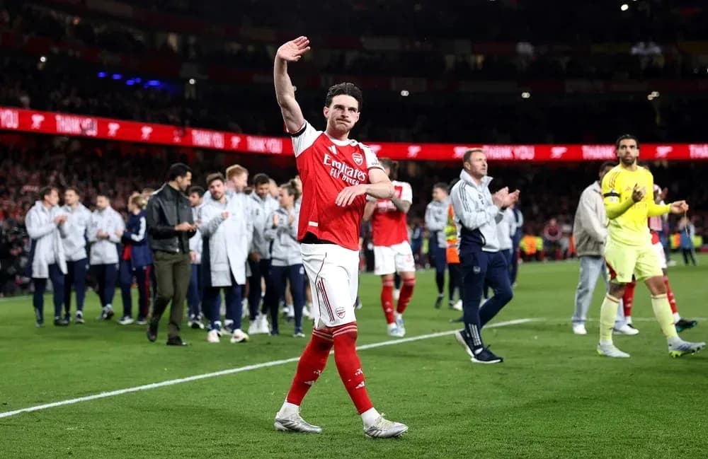 Player waving to fans after match at Emirates Stadium