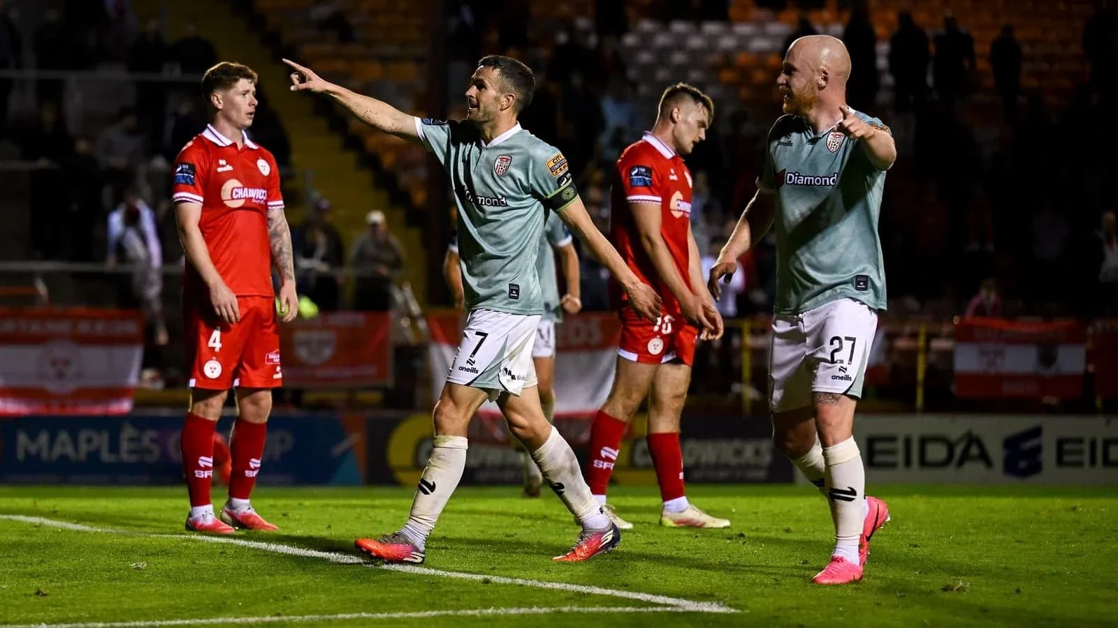 Players celebrating after scoring during a match