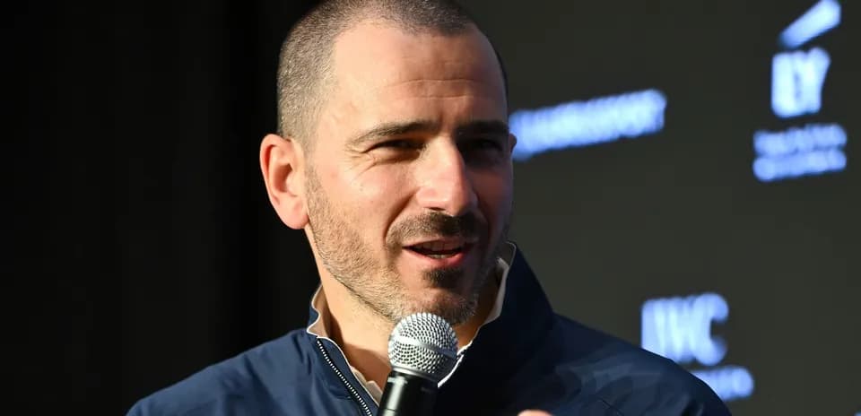 Man speaking into a microphone at event