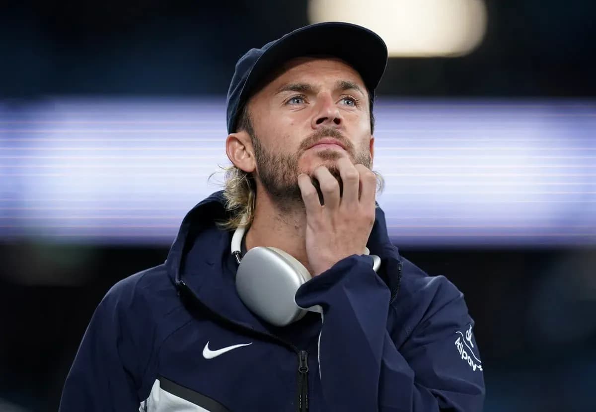 Person wearing headphones, pondering during event