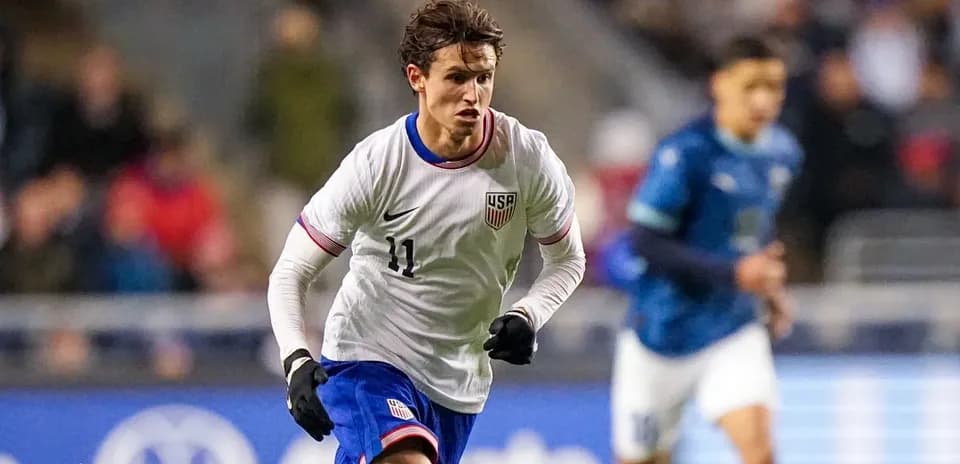 Player wearing USA jersey running during match