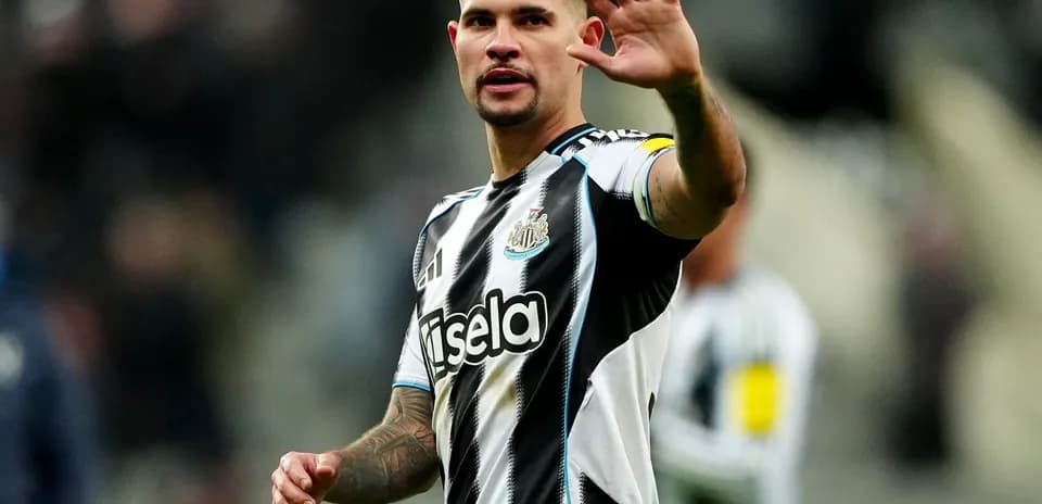 Newcastle player waving to fans during match