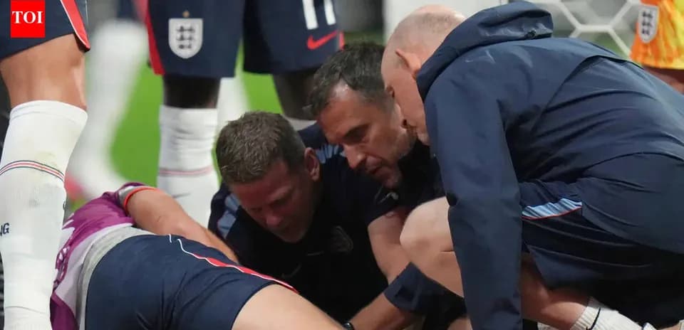 Medical staff attending to injured player on field