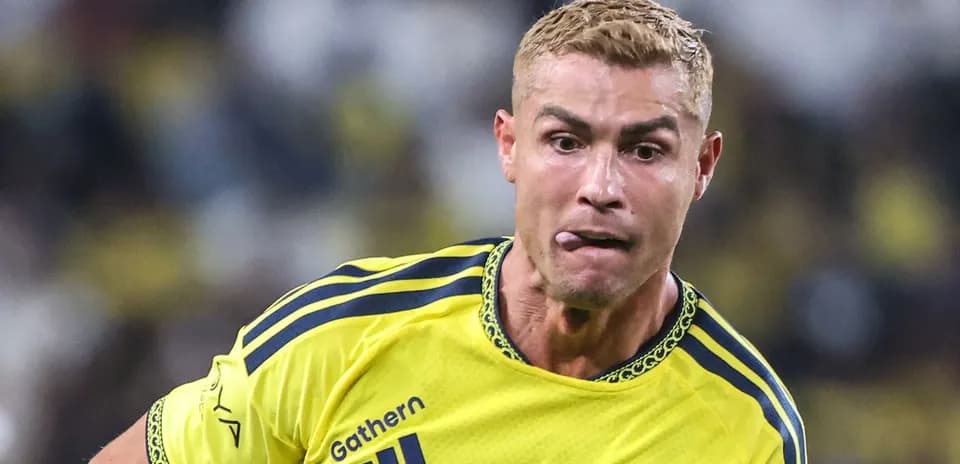 Player in yellow jersey running with ball during match