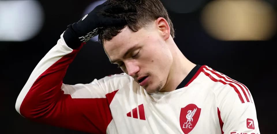 Player in Liverpool kit with head down in disappointment